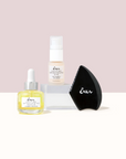 An image of the Daytime Brightening Serum (Yellow) and Daytime Brightening Eye (Cream) with a Gua Sha (Black)  against the Cream and white Background.